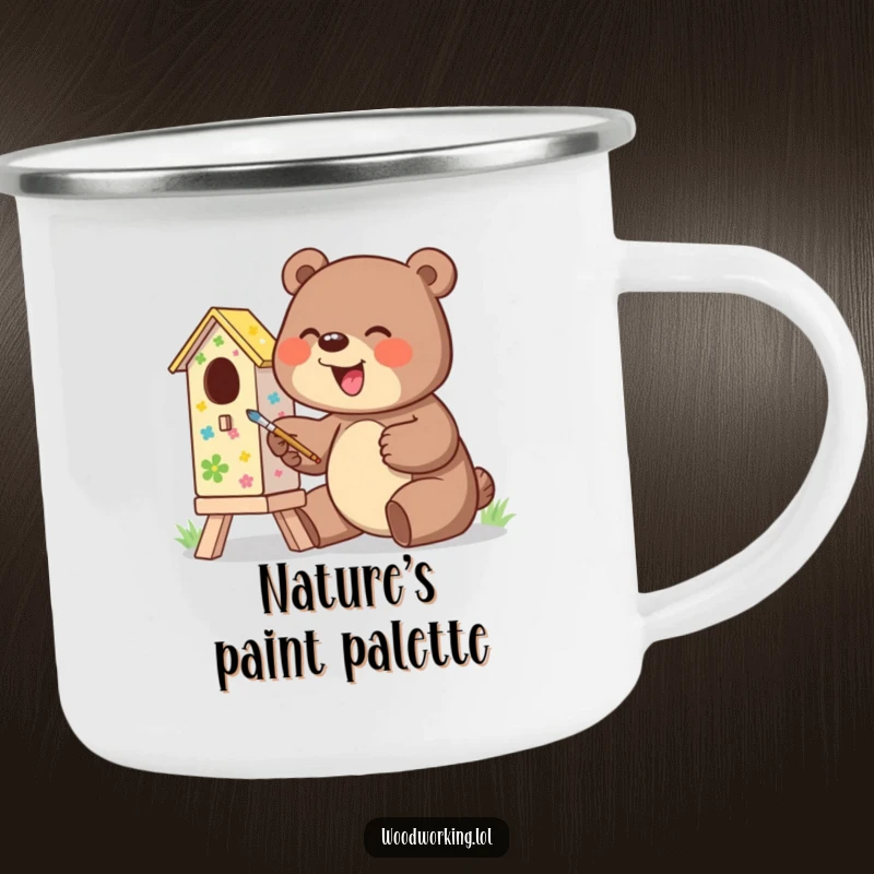 Funny camping mug with a giggling bear excitedly painting a colorful birdhouse, durable and humorous.