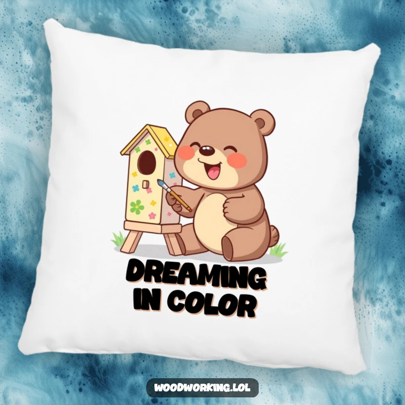 Funny pillow featuring a giggling bear excitedly painting a colorful birdhouse, soft and humorous.