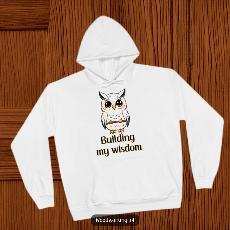 Funny owl hoodie featuring a content owl meticulously sketching a birdhouse blueprint, embodying wisdom and architectural talent.