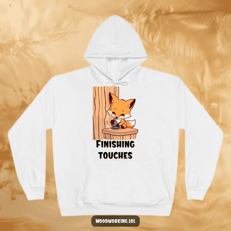 Funny fox carpenter hoodie, a determined artisan sanding wood, offering warmth and humor for DIY enthusiasts.
