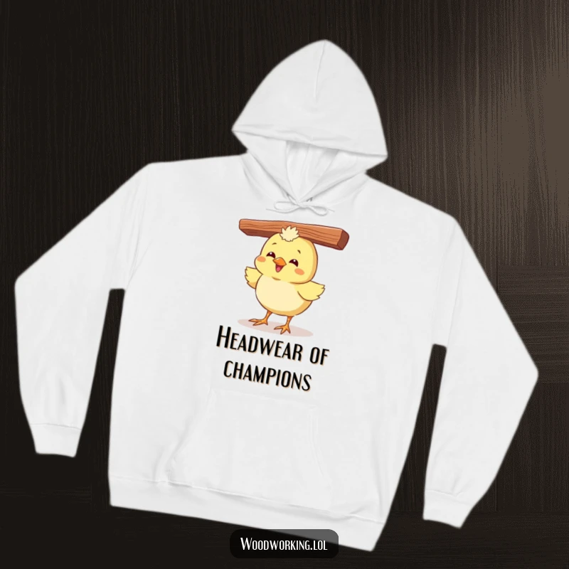 Funny hoodie showcasing a giggling chick with a plank balanced on its head, radiating pure, silly joy.