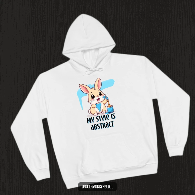 Funny rabbit hoodie depicting a surprised bunny covered in vibrant blue paint, offering warmth and humorous artistic flair.