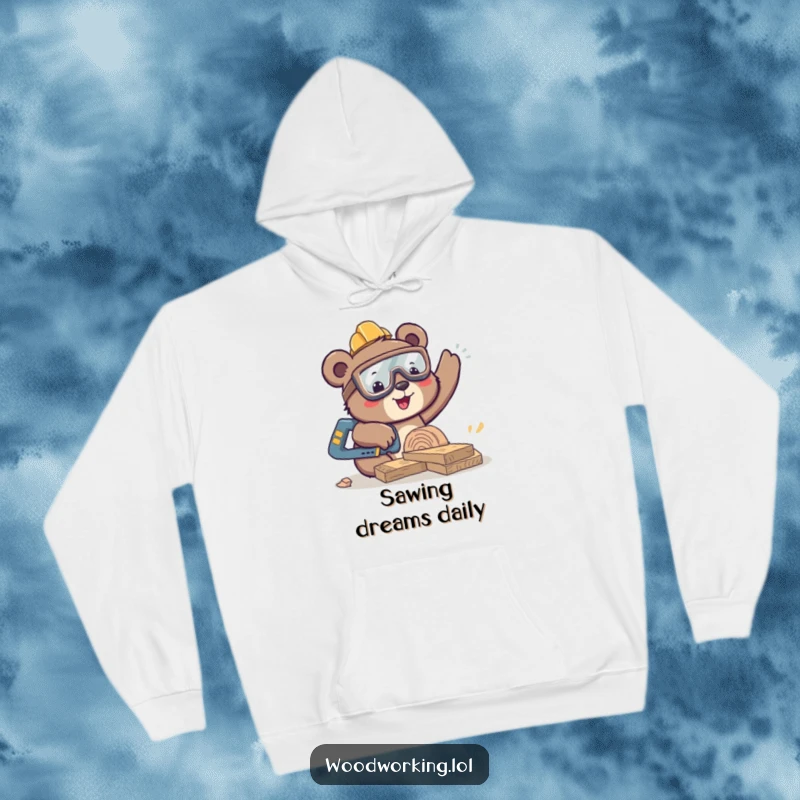 Funny bear wearing safety goggles and sawing wood, cozy hoodie, symbolizes happy woodworking, perfect funny gift.