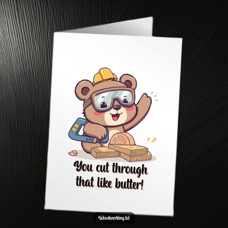 Funny Free Printable Bear Woodworker Card: Bear in safety goggles sawing wood, celebrating DIY accomplishments.
