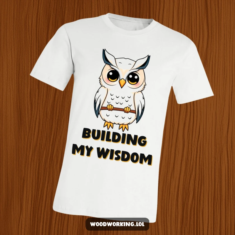 Funny owl t-shirt depicting a content owl carefully sketching a birdhouse blueprint, showcasing its architectural and design skills.