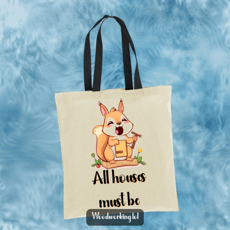 Funny squirrel tote bag, a happy cartoon squirrel painting a small birdhouse, a charming and humorous accessory.