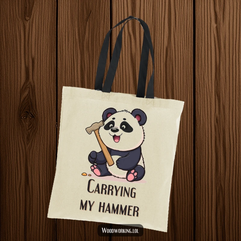 Funny panda carpenter tote bag, playfully hammering a nail with a large hammer, great for carrying DIY gear.
