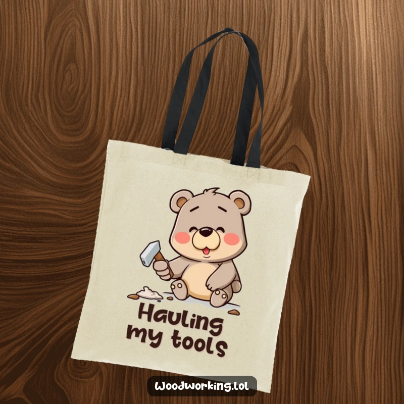 Funny tote bag with a determined cartoon bear happily hammering a crooked nail, great for errands and humor.